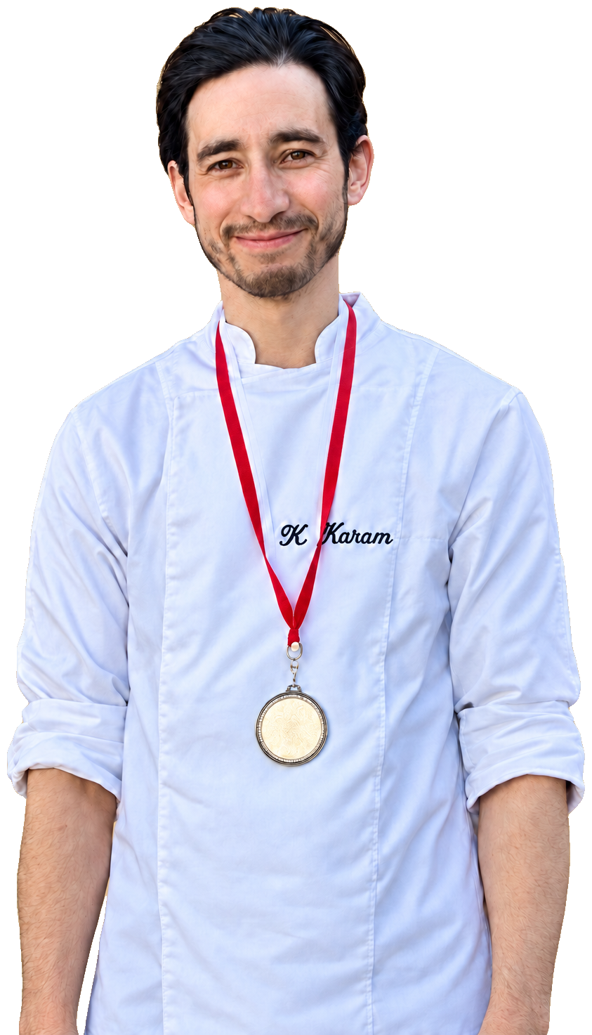 Karam Hakkou in his chef jacket with the silver medal